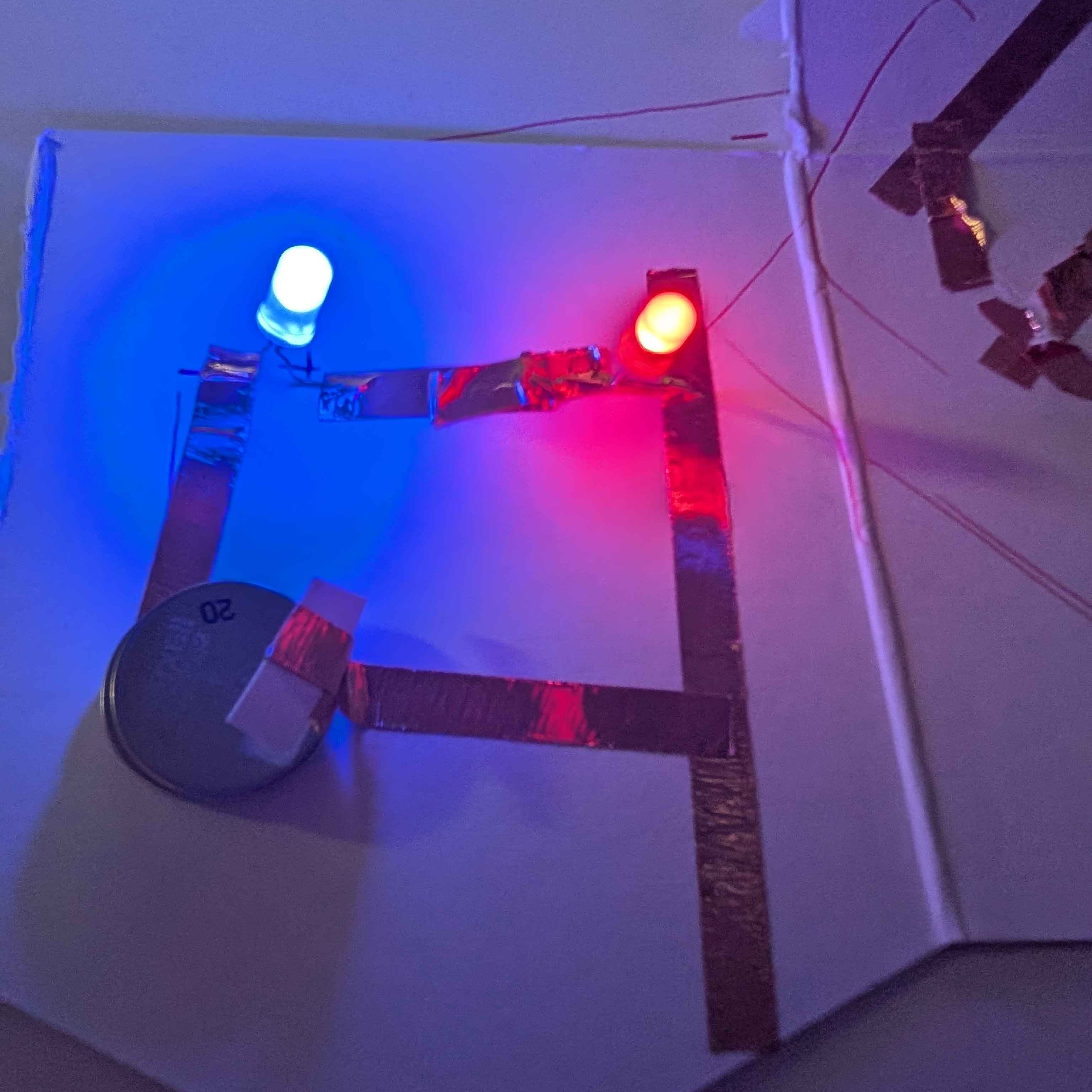 My first sucessful circut after plenty of trial and error. I approached this assignment much like how someone would approach a jigsaw puzzle. Stare at it and just figure it out along the way. While this method was frusturating due to the many errors that occured, I was learning from my mistakes and doing my best to then avoid them in future attempts. I made this circut at my house after finding out one of the LEDs I had broke, leaving me with only two colors that reminded me of police sirens. 