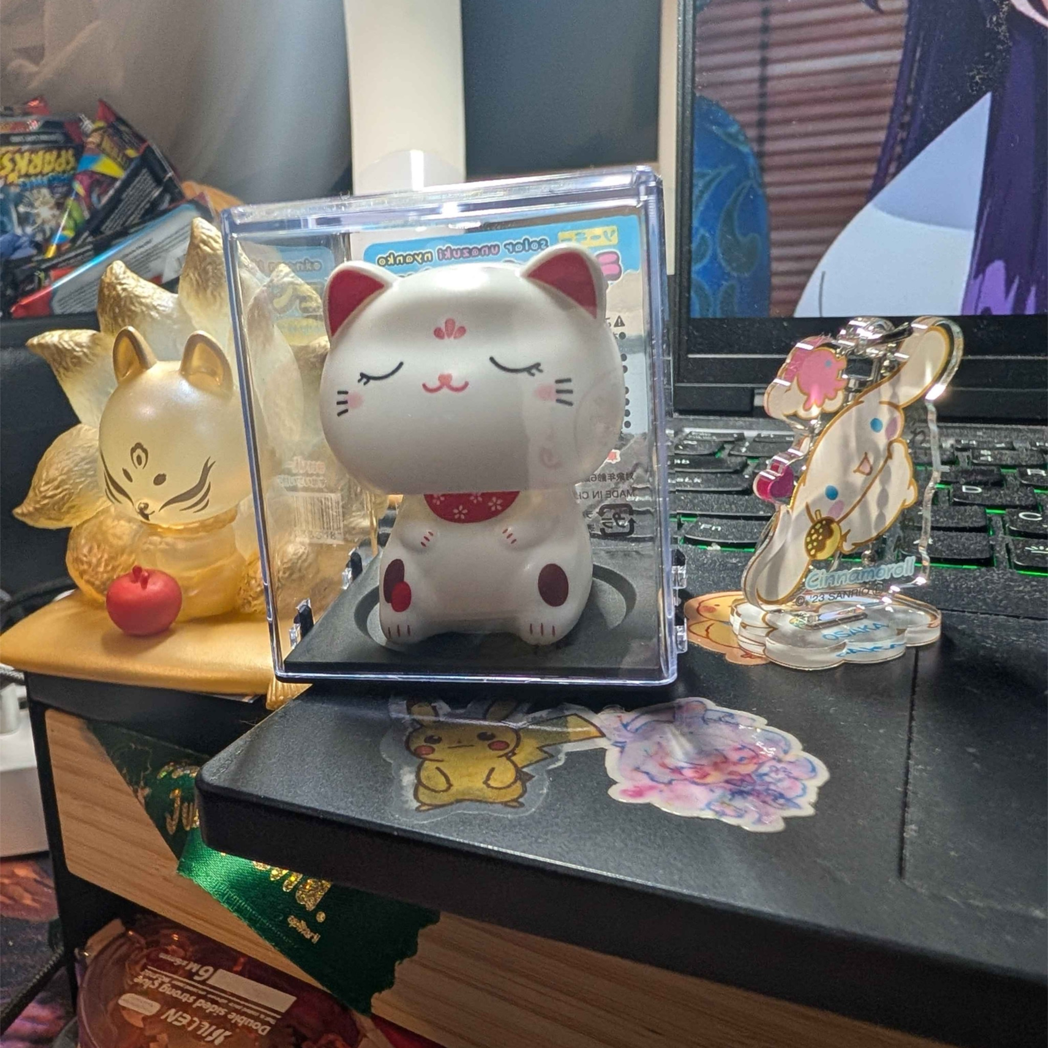 I have a lucky cat or maneki nrko resting on my desk to accompany me while working, it operates of sunlight supposedly. But I found that it works just as well, if not better with artificial light such as a lamp. So why not add LED lights to keep it on?